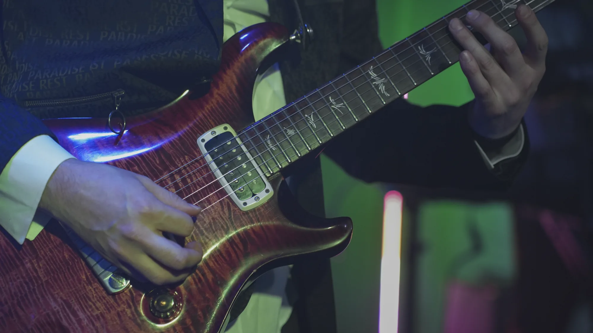 Close-up of a guitar during a live performance