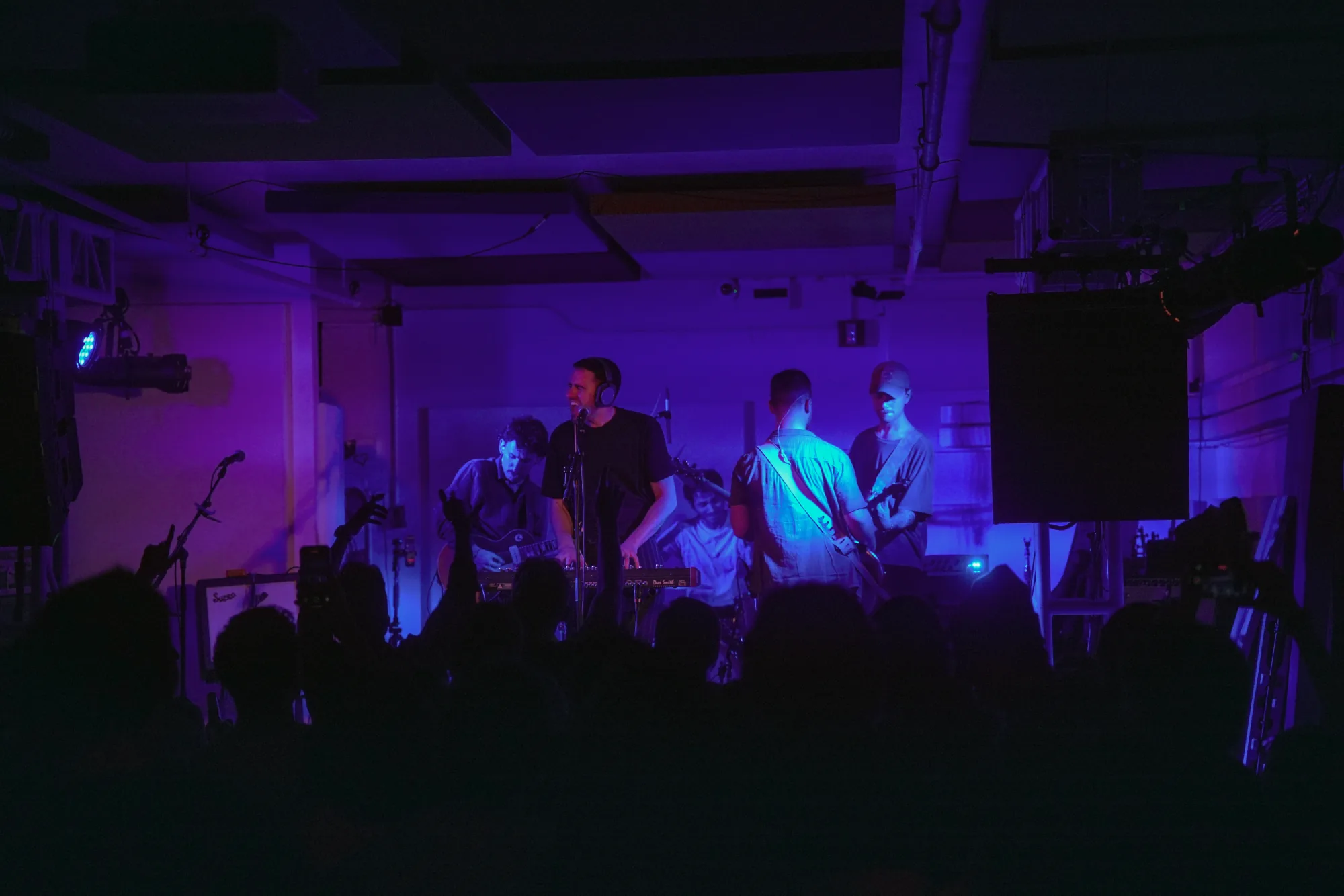 Wide view of MoonWater performing for an audience